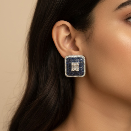 Square royal blue crystal stud earrings with central white stone.